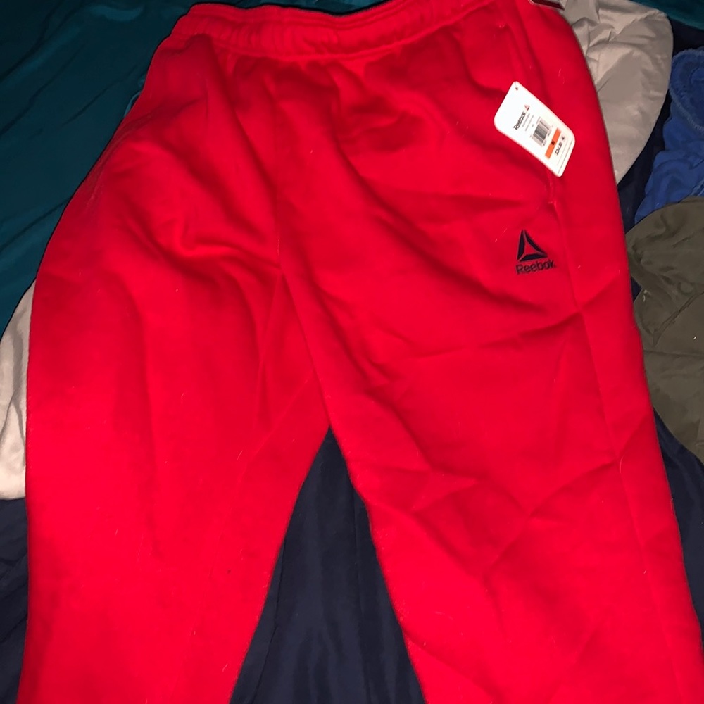 Red Reebok sweat pants